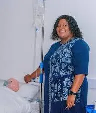 Sister (SR) Rutendo T. Zvidza, founder of PMT Health Care Institution, with a patient.