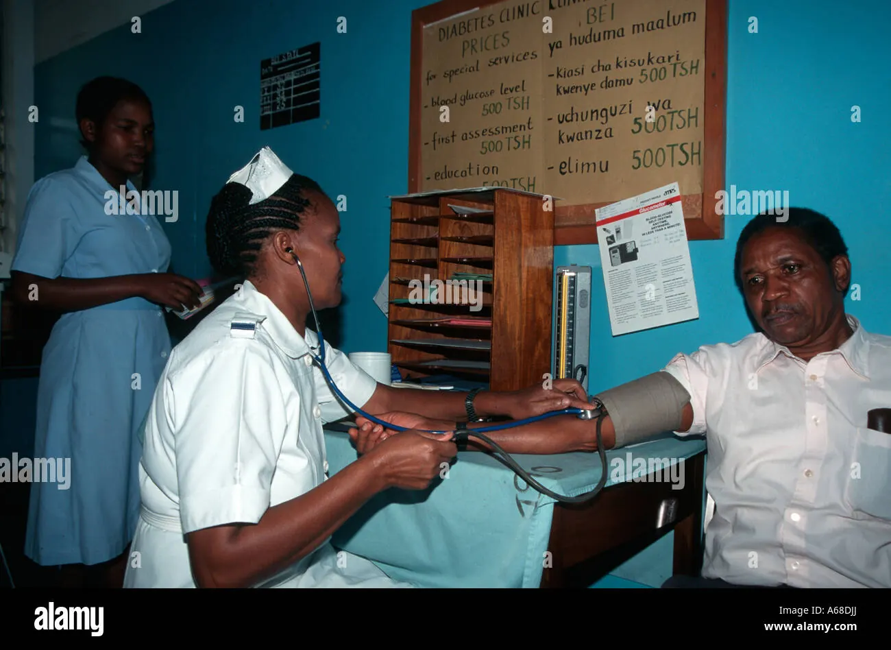 Nurse checking a patient's blood pressure.