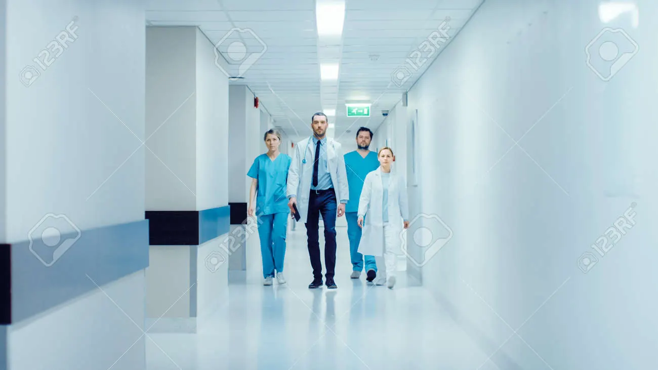 Nurse walking through a hospital corridor.