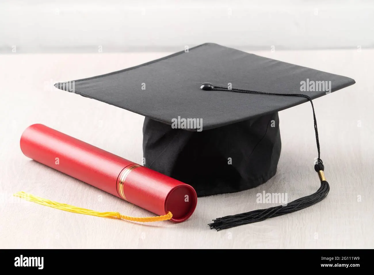 Graduation diploma and cap close-up.