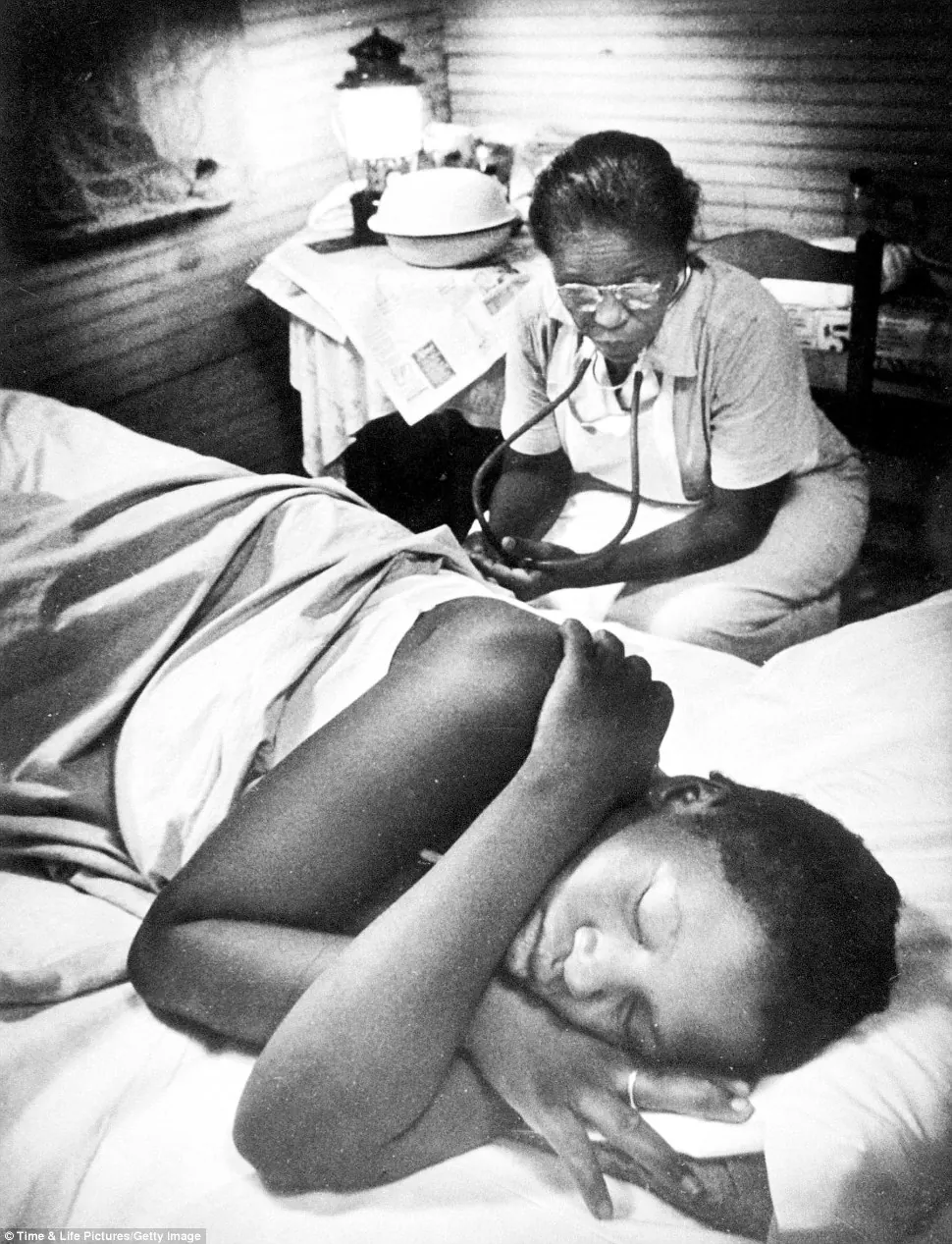 Midwife caring for newborn baby.