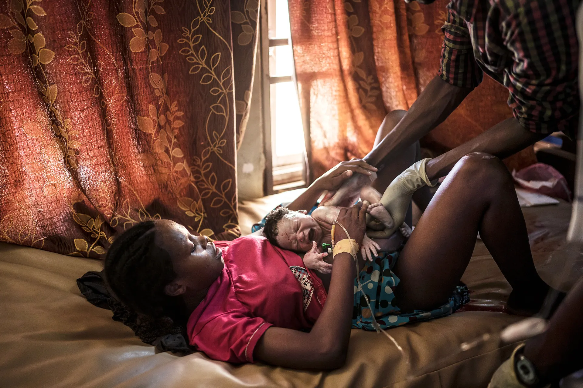 Midwife with newborn.