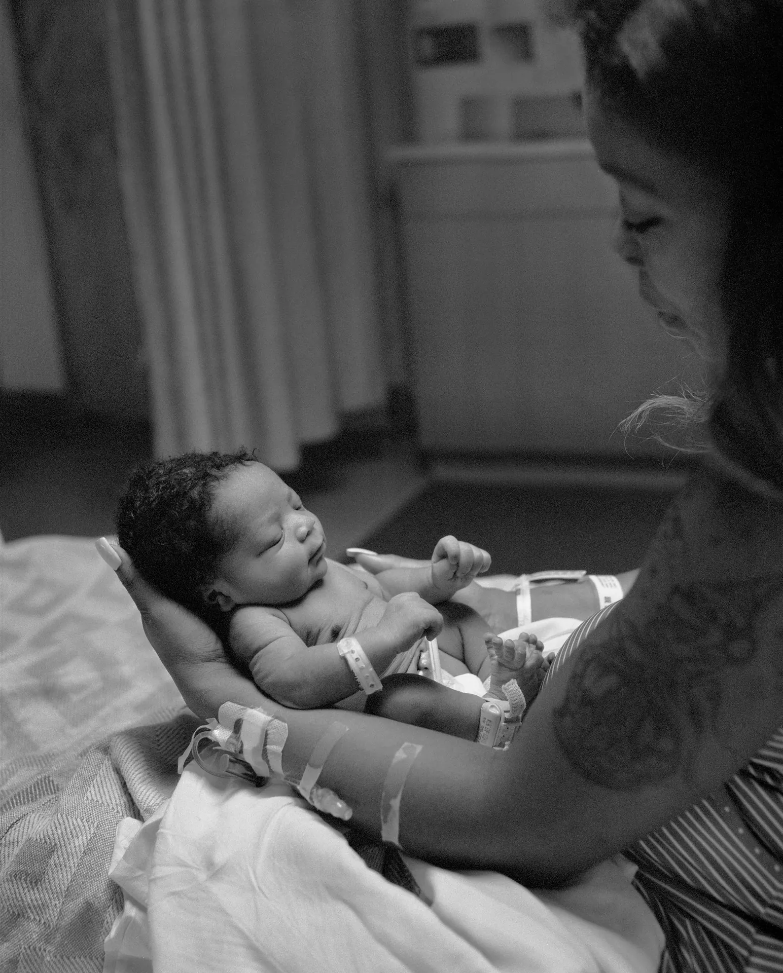 Midwife caring for newborn baby.