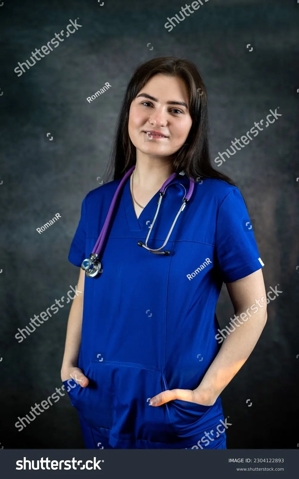 Nursing student with stethoscope in professional setting.